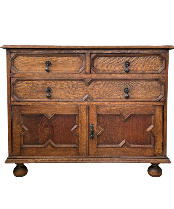 Early 20th Century Antique Jacobean Style English Cabinet with Oak Construction and Metal Drop Pulls
