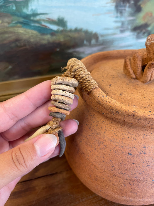 Handmade Indonesian Terracotta Lidded Jar with Beaded Raffia Accents and Seated Figure Finial