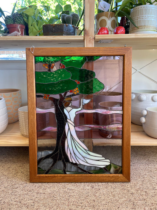 Vintage Stained Glass Art Panel Depicting Woman in Flowing White Dress Beneath Tree with Fruit, Framed in Wooden Oak Toned Frame