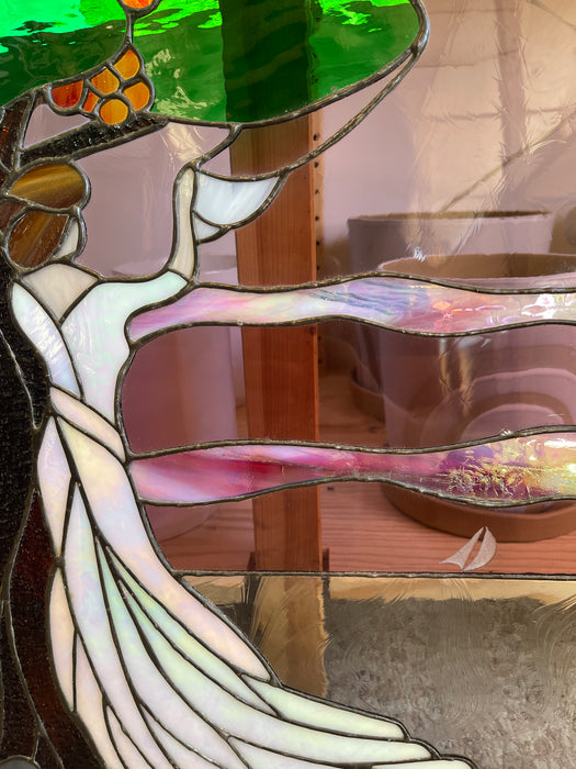 Vintage Stained Glass Art Panel Depicting Woman in Flowing White Dress Beneath Tree with Fruit, Framed in Wooden Oak Toned Frame