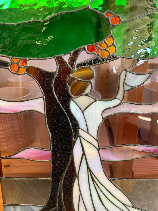 Vintage Stained Glass Art Panel Depicting Woman in Flowing White Dress Beneath Tree with Fruit, Framed in Wooden Oak Toned Frame