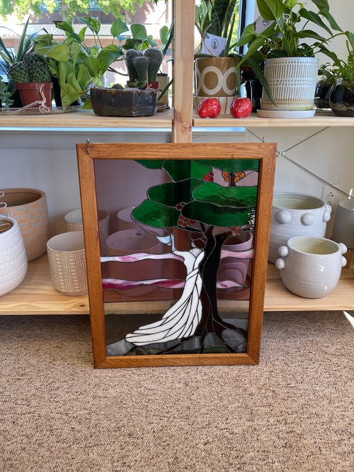 Vintage Stained Glass Art Panel Depicting Woman in Flowing White Dress Beneath Tree with Fruit, Framed in Wooden Oak Toned Frame