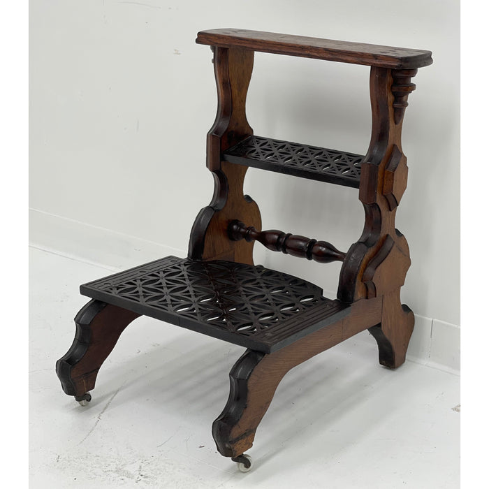 Antique decorative library steps table with metal accent and casters