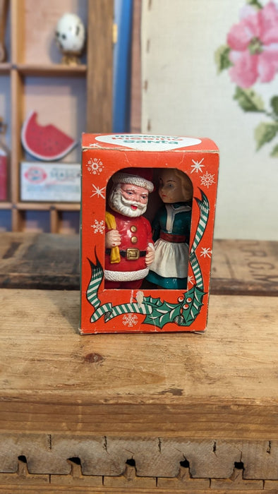 Vintage Mommy kissing Santa plastic figures with Box.