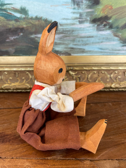Vintage Hand-Carved Wooden Rabbit Doll with Articulated Limbs and Handmade Clothing.