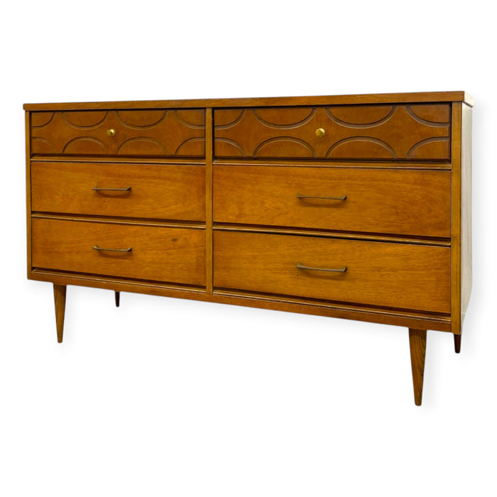 Vintage Bassett Mid Century Modern Walnut Double 6 Drawer Dresser with Carved Details.