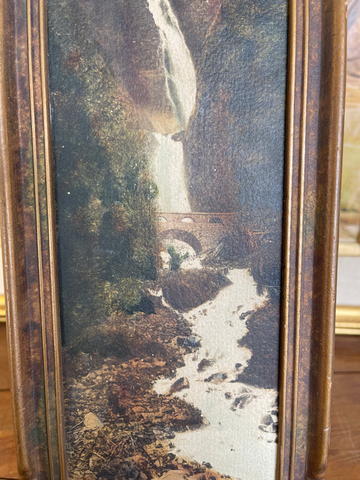 Vintage Tinted Landscape Photograph of Waterfall and Stone Bridge in Ornate