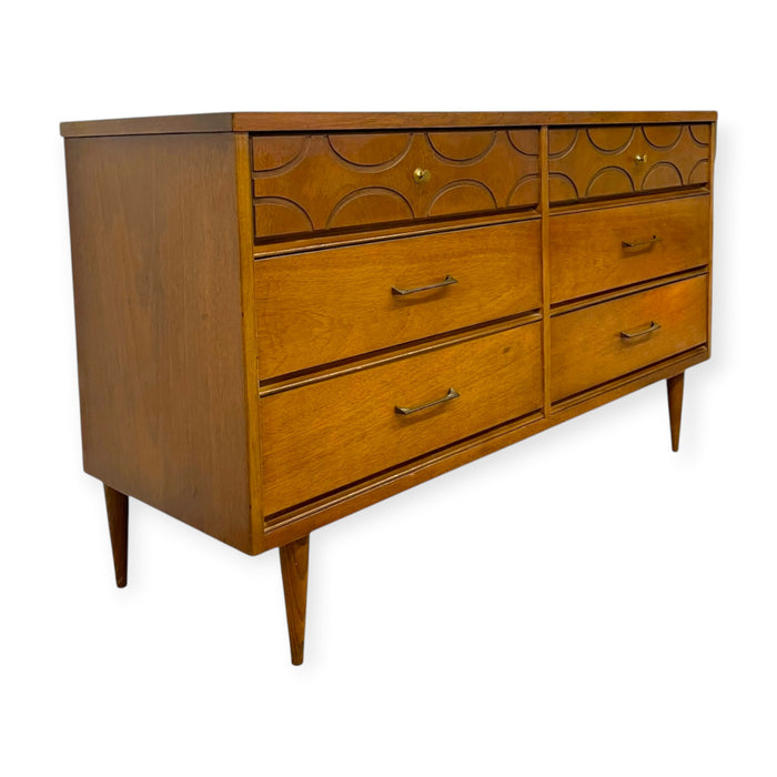 Vintage Bassett Mid Century Modern Walnut Double 6 Drawer Dresser with Carved Details.