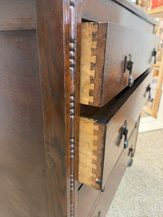 Vintage Four Drawer Dresser on Casters With Carved Wood Detailing.