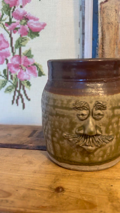 Vintage Handmade glaze pottery with abstract face.