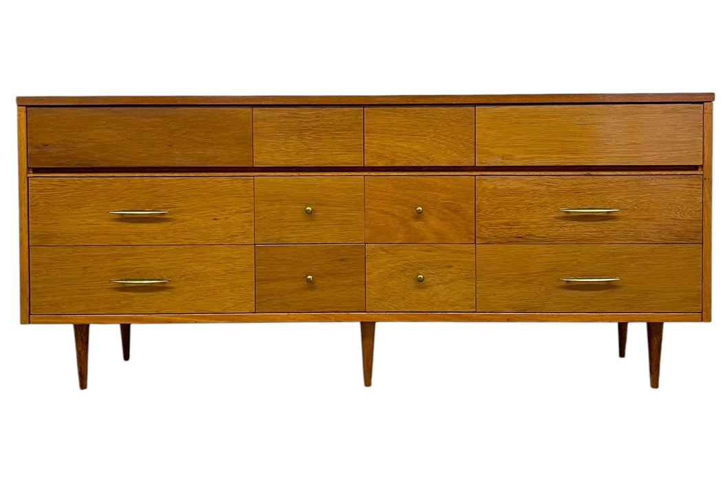 Vintage Mid Century Modern Credenza Dresser with 12 Drawers, Tapered Legs and Brass-Toned Hardware