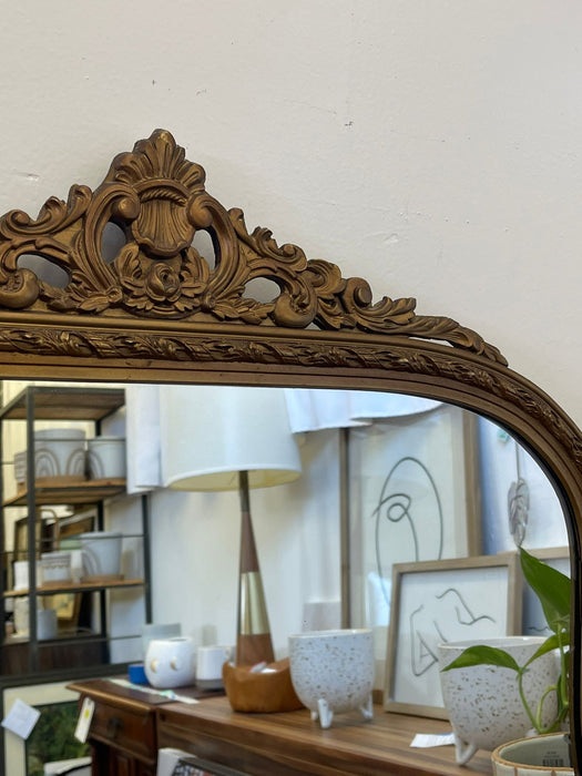 Vintage Arched Ornate Carved Gilt Wood Framed Mirror. Circa 1940s With Floral Motif.