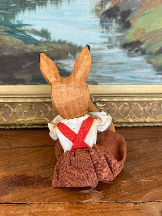 Vintage Hand-Carved Wooden Rabbit Doll with Articulated Limbs and Handmade Clothing.