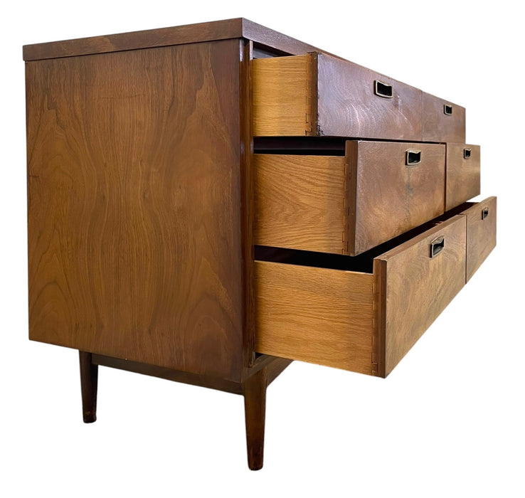 Mid Century Modern 6 Drawer Dresser with Sculpted Base and Brass-Toned Pulls.