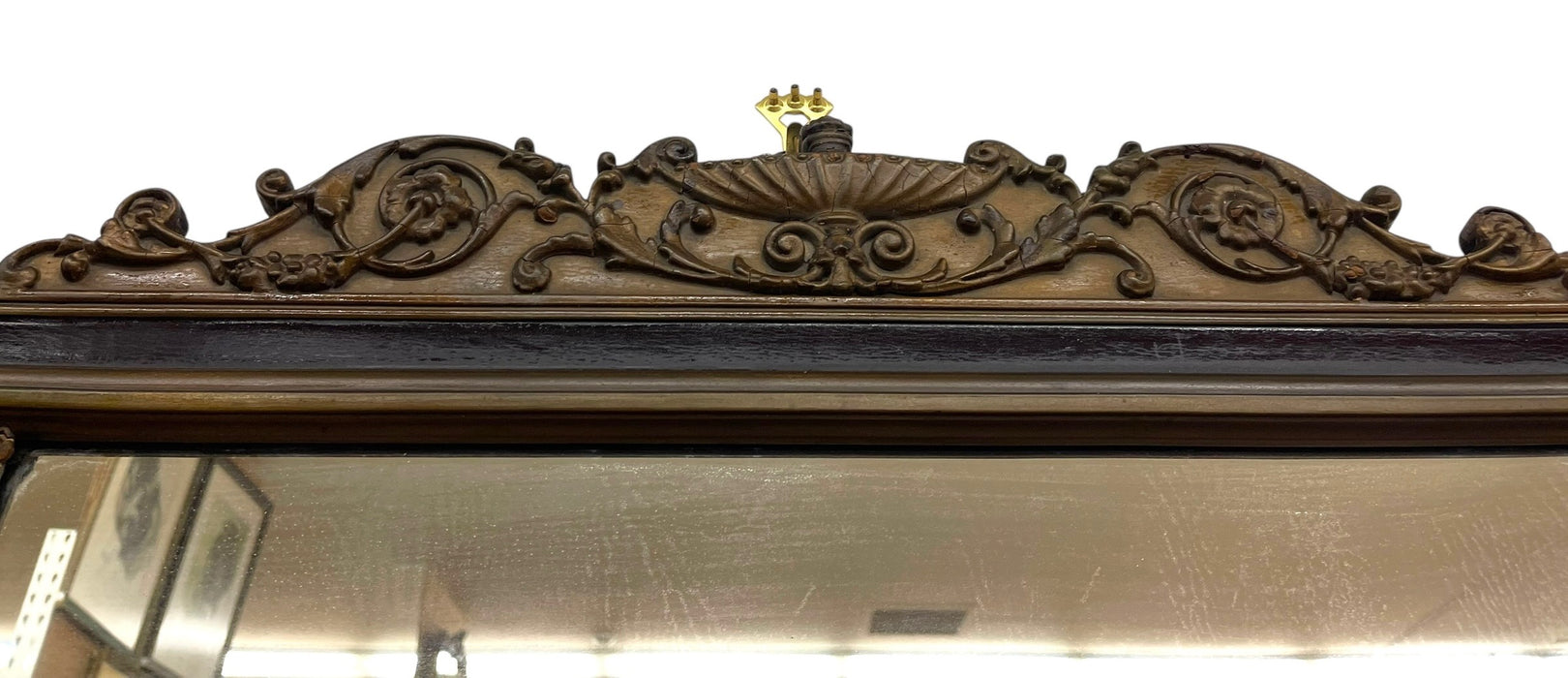 Antique Carved Wood Overmantel Mirror with Floral Urn Motifs and Scrolled Crest.