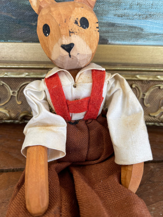 Vintage Hand-Carved Wooden Rabbit Doll with Articulated Limbs and Handmade Clothing.