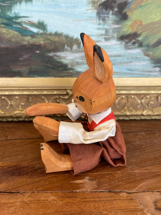 Vintage Hand-Carved Wooden Rabbit Doll with Articulated Limbs and Handmade Clothing.