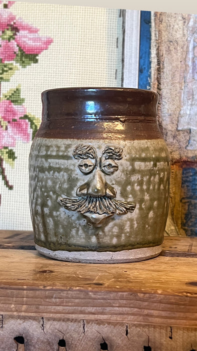 Vintage Handmade glaze pottery with abstract face.