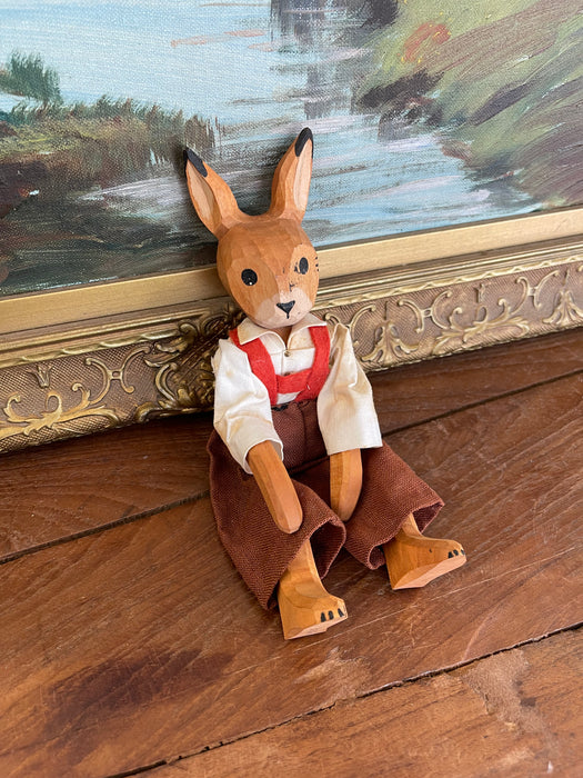 Vintage Hand-Carved Wooden Rabbit Doll with Articulated Limbs and Handmade Clothing.