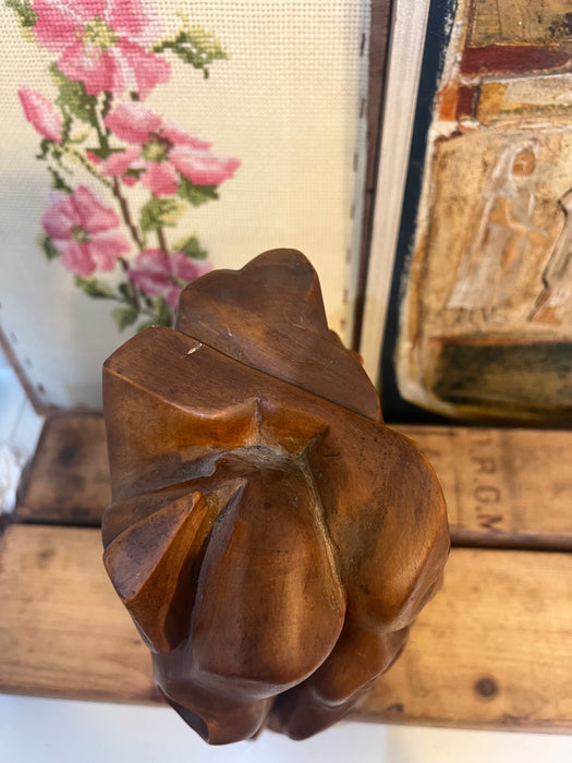 Vintage handmade abstract wood sculpture in mid century modern style with faces depicted.