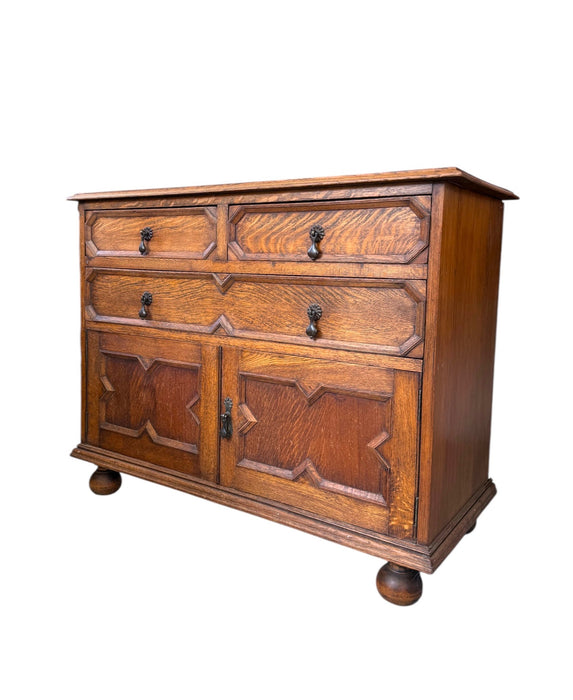 Early 20th Century Antique Jacobean Style English Cabinet with Oak Construction and Metal Drop Pulls