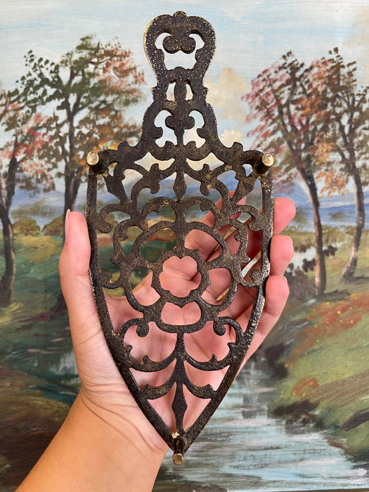 Brass Toned Cast Trivet with Ornate Victorian Design.