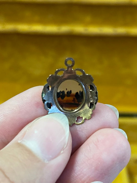 Vintage Gold-Tone Miniature Landscape-Like Pendant with Ornate Filigree
Frame.