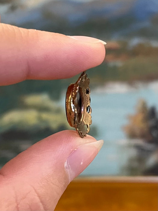 Vintage Gold-Tone Miniature Landscape-Like Pendant with Ornate Filigree
Frame.