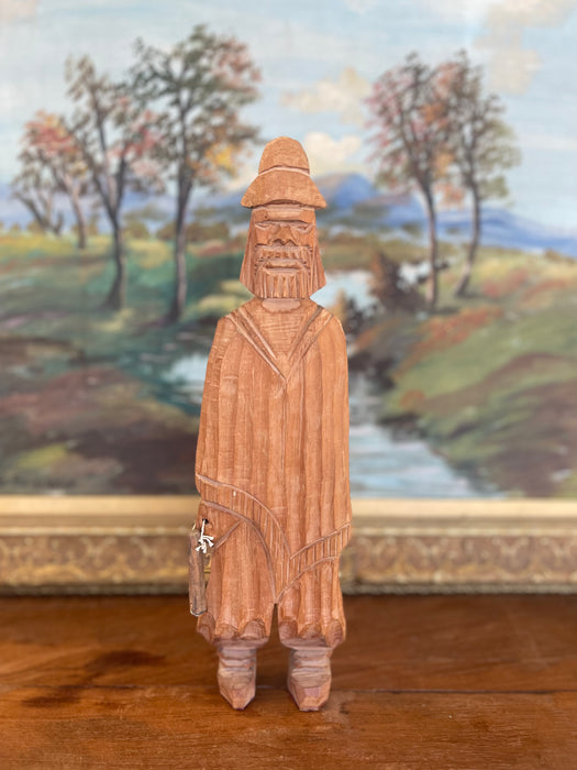 Hand-Carved Vintage Folk Art Wood Figure of Bearded Man with Hat and Carrying a Carved Object.