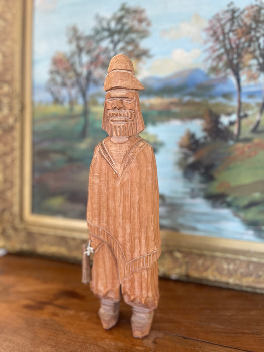 Hand-Carved Vintage Folk Art Wood Figure of Bearded Man with Hat and Carrying a Carved Object.