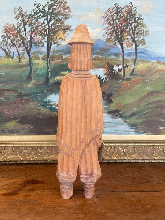 Hand-Carved Vintage Folk Art Wood Figure of Bearded Man with Hat and Carrying a Carved Object.