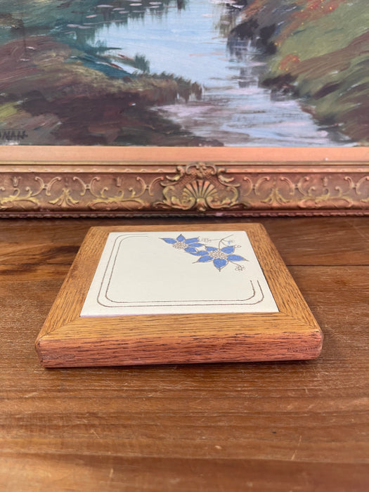 Vintage Handcrafted Ceramic Tile with Likely Oak Frame and Blue Floral Motif, Made in USA.