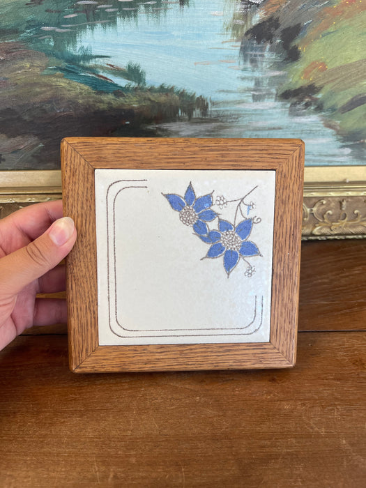 Vintage Handcrafted Ceramic Tile with Likely Oak Frame and Blue Floral Motif, Made in USA.