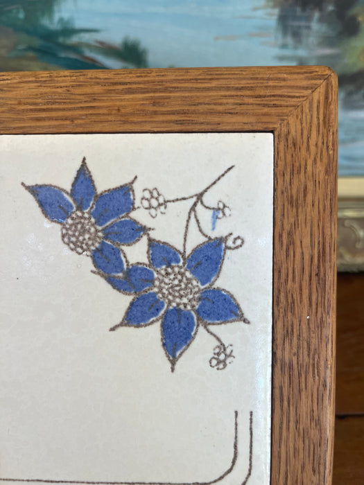 Vintage Handcrafted Ceramic Tile with Likely Oak Frame and Blue Floral Motif, Made in USA.