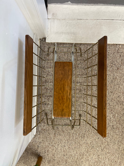 1960s Mid-Century Modern Brass Toned Wire and Wood Magazine Rack with Sculptural Handle.