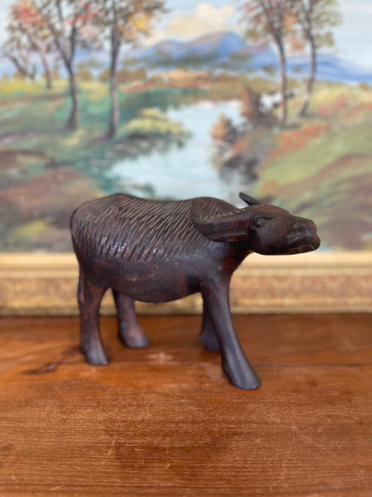 Vintage Hand-Carved Wooden Water Buffalo Sculpture with Textured Detailing.