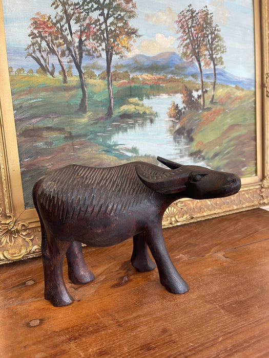 Vintage Hand-Carved Wooden Water Buffalo Sculpture with Textured Detailing.