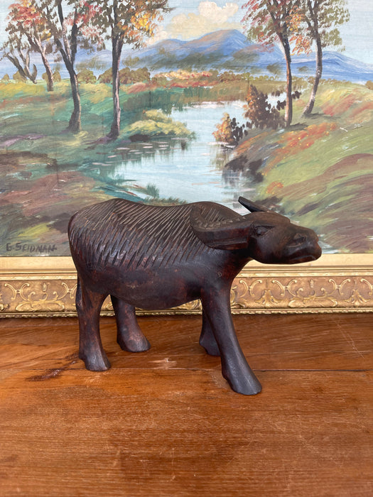 Vintage Hand-Carved Wooden Water Buffalo Sculpture with Textured Detailing.