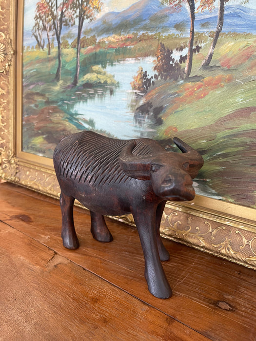 Vintage Hand-Carved Wooden Water Buffalo Sculpture with Textured Detailing.