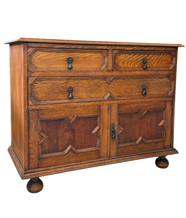 Early 20th Century Antique Jacobean Style English Cabinet with Oak Construction and Metal Drop Pulls