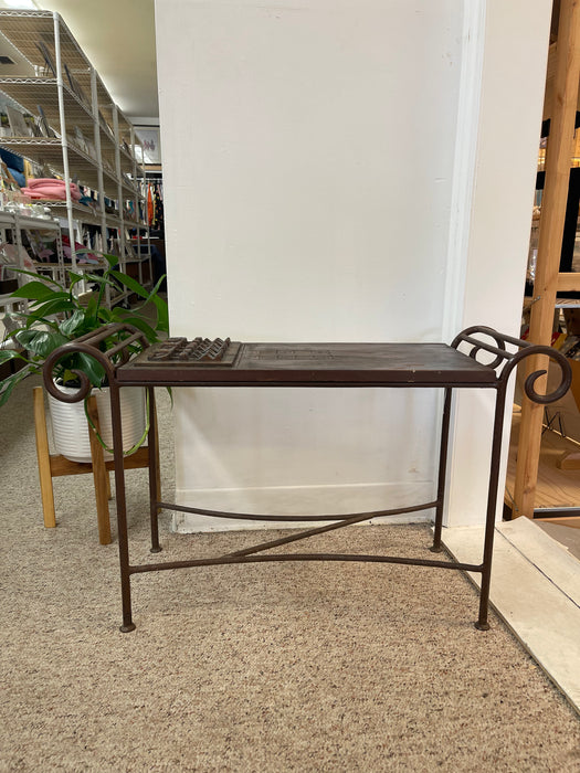 Vintage Hand-Carved Wood and Wrought Iron Console Table with Tribal Motifs and Scrollwork Arms
