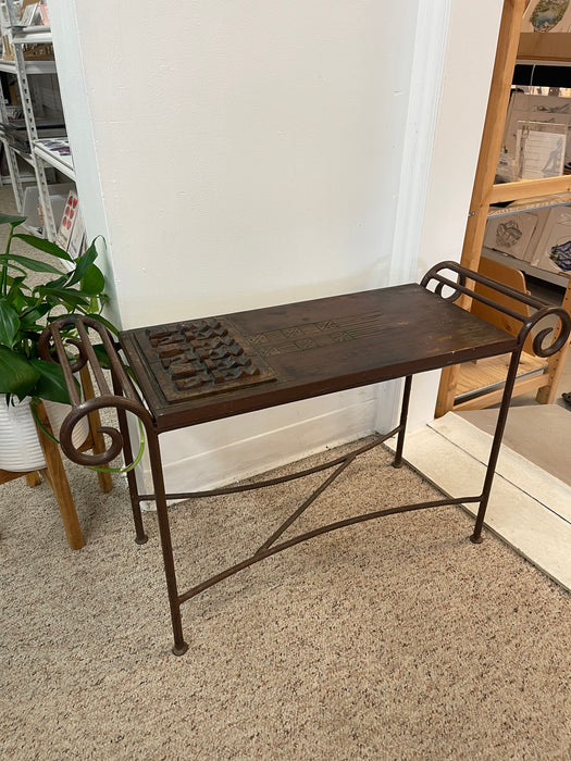 Vintage Hand-Carved Wood and Wrought Iron Console Table with Tribal Motifs and Scrollwork Arms