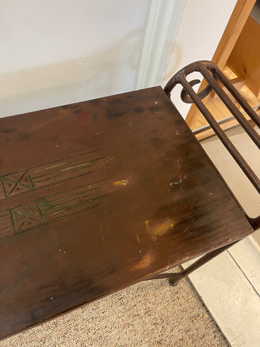 Vintage Hand-Carved Wood and Wrought Iron Console Table with Tribal Motifs and Scrollwork Arms