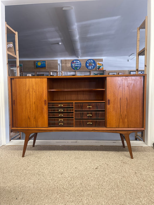 Mid-Century Danish Modern Likely Teak Credenza with Sculpted Base, Likely Rosewood Drawer Fronts with Brass toned Pulls