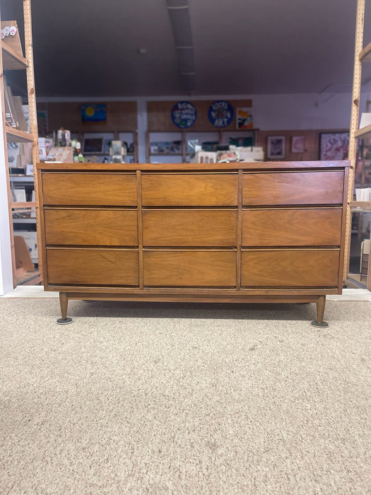 Mid-Century Modern Likely Walnut Nine-Drawer Dresser with Sculpted Pulls, Dovetail Drawers, and Tapered Legs
