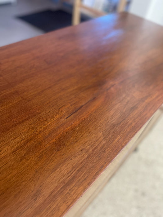 Mid-Century Modern Likely Walnut Nine-Drawer Dresser with Sculpted Pulls, Dovetail Drawers, and Tapered Legs