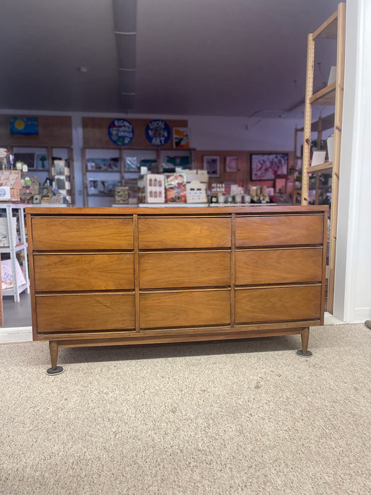 Mid-Century Modern Likely Walnut Nine-Drawer Dresser with Sculpted Pulls, Dovetail Drawers, and Tapered Legs