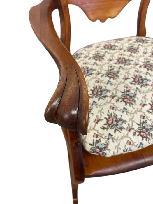 Likely Antique Victorian Style Solid Wood Rocking Chair with Carved Arms and Floral Cushion
