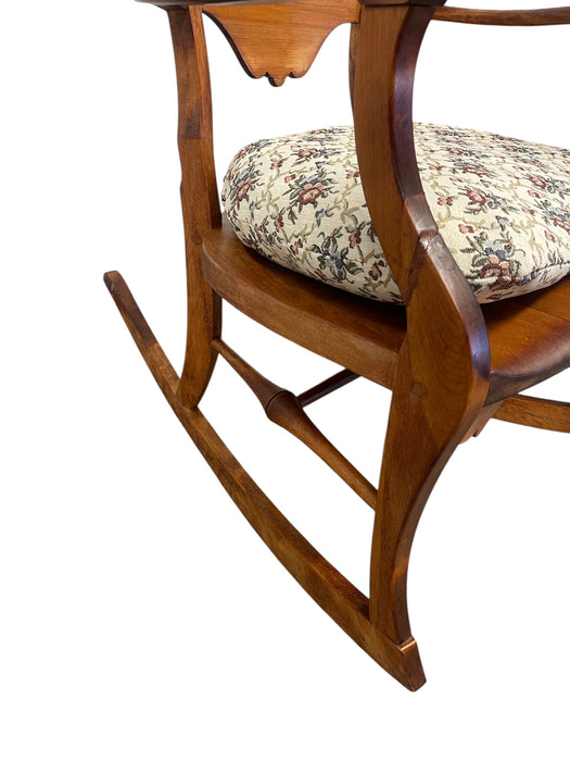 Likely Antique Victorian Style Solid Wood Rocking Chair with Carved Arms and Floral Cushion
