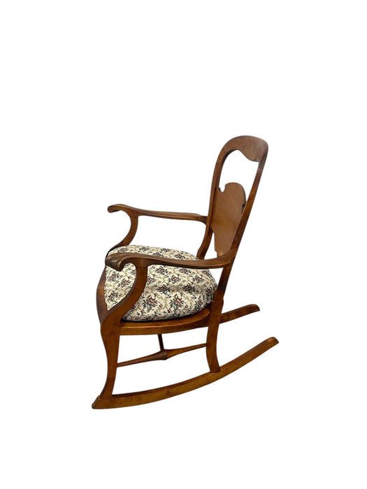 Likely Antique Victorian Style Solid Wood Rocking Chair with Carved Arms and Floral Cushion